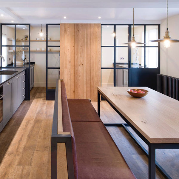 wooden kitchen with hanging industrial lights