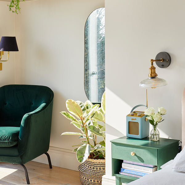 A sunny interior with green seat and metallic light by Industville