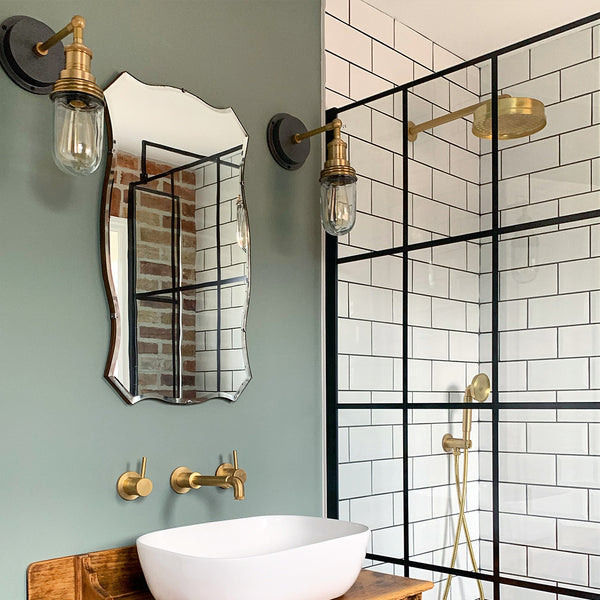 Bathroom with shower and brass fixtures