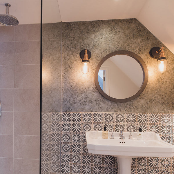 Shower and bathroom with circular mirror