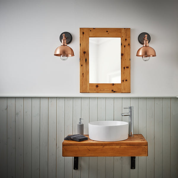 bathroom mirror and sink with tap