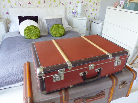 vintage suitcases inside a retro bedroom