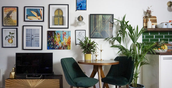 Artwork and vintage lighting in a jewel tone interior 