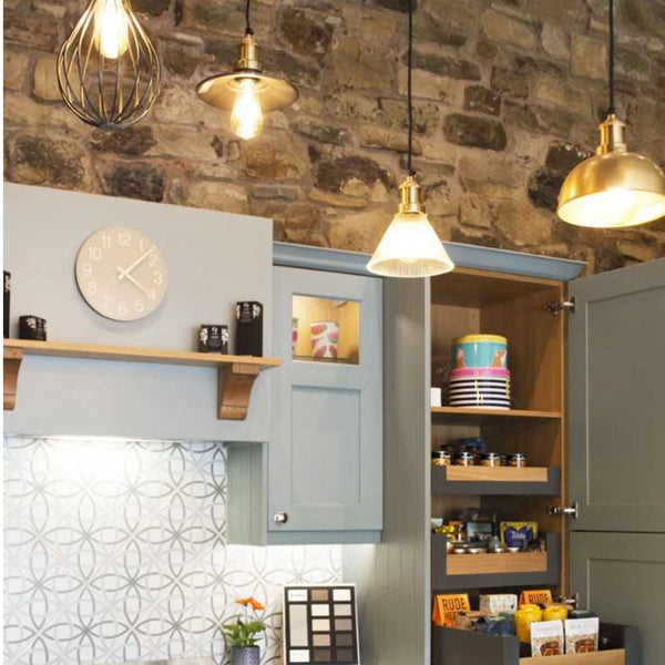 Kitchen with stone walls and hanging lights