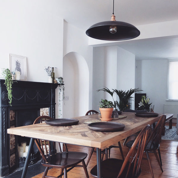 Dining room interior with industrial pendant light