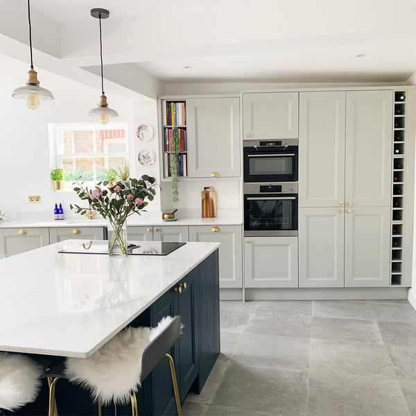 Industrial lights shining on kitchen island