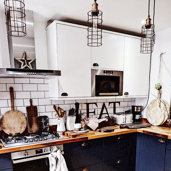 Kitchen with hanging ceiling caged lights