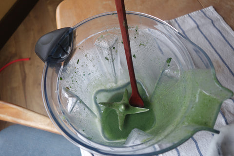 Green smoothie with tasting spoon