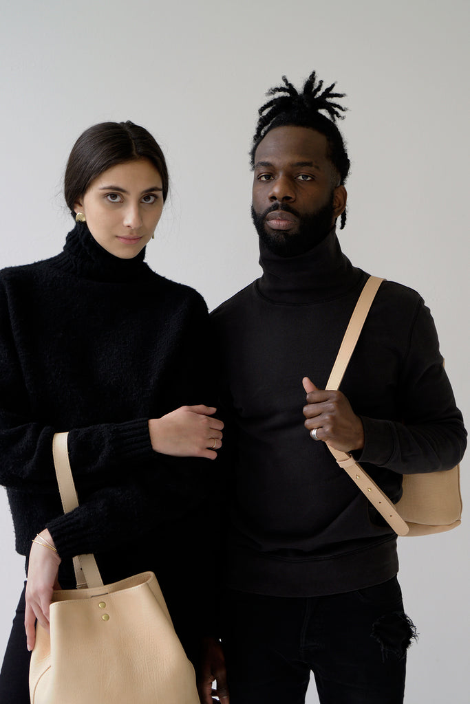 male model and female model with leather bucketbags