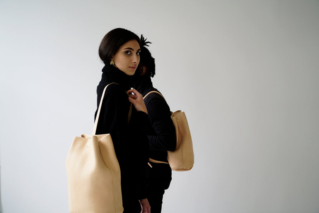 female model with leather backpack