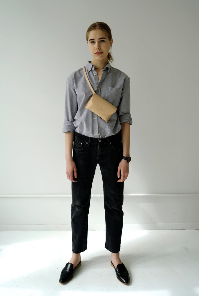 Female model with leather fanny pack
