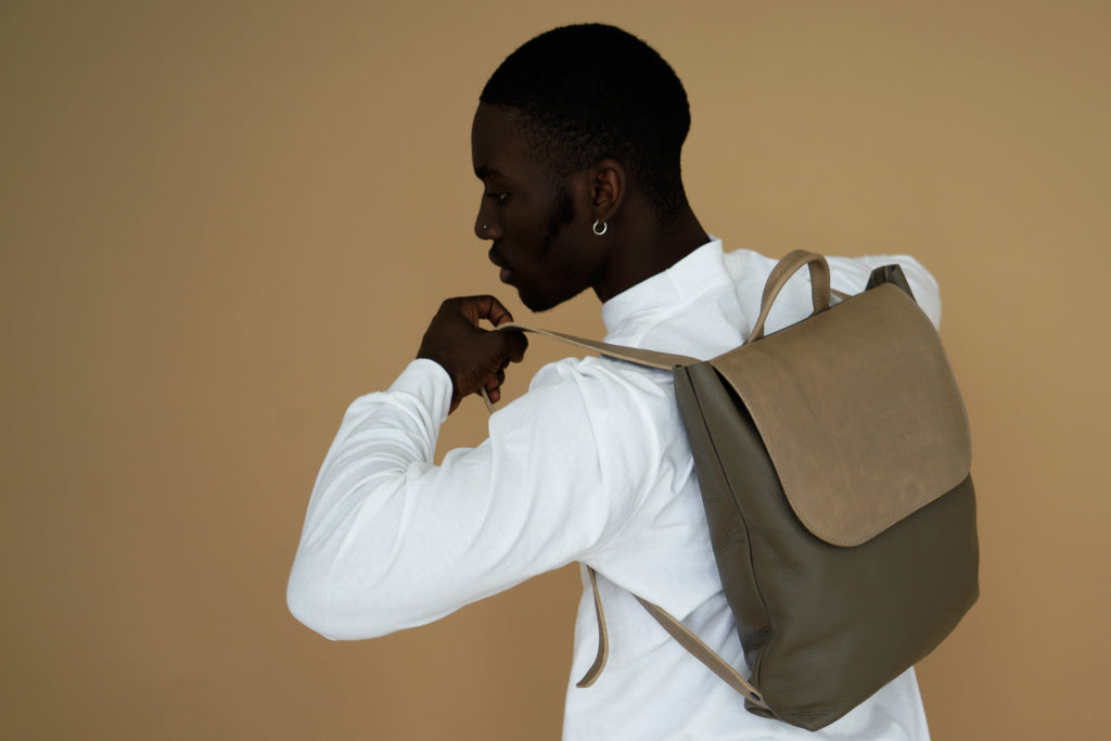 male model with leather backpack