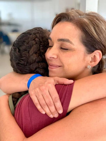 Woman Hugging Child