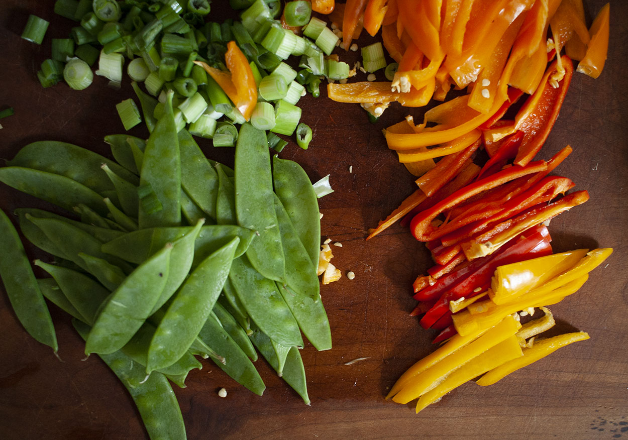 Keep your prepped veggies separate on the cutting board because you will add at intervals to your carbon steel handmade wok.