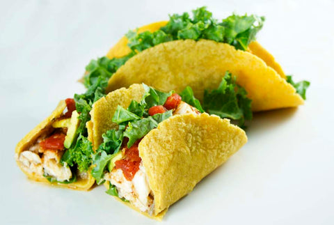 Catfish tacos loaded with kale, salsa, and avocado