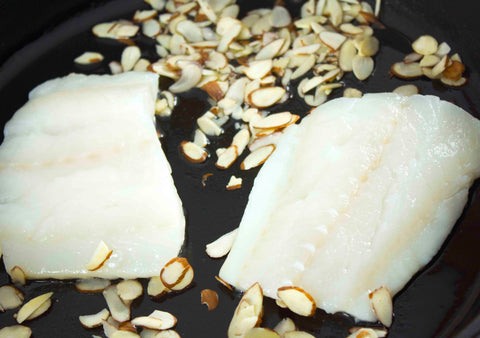 Raw cod and almond slivers