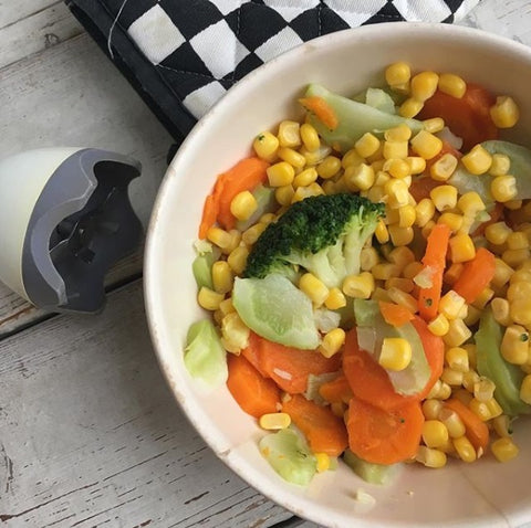 less waste weaning - photo of a bowl of leftover vegetables and a hand blender