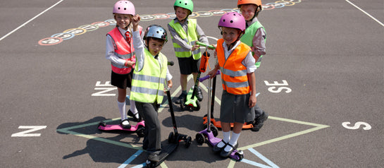 Kids on their Micro Scooters at school