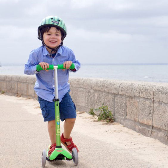 Little boy scooting on Mini Micro Deluxe 