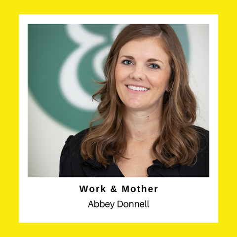 woman smiling at the camera with work and mother logo in the background