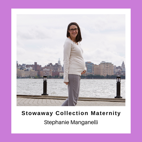 pregnant woman standing on walkway by the river