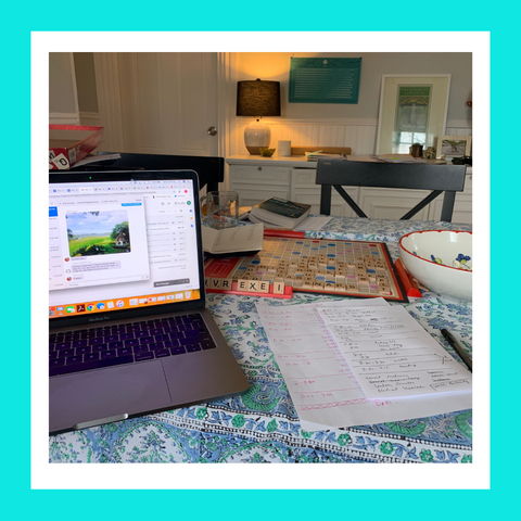 Workspace at a table with a laptop and papers