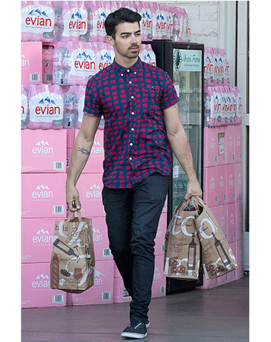 Joe Jonas wears his collar buttoned