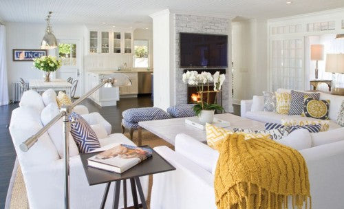 chango & co, white yellow room, white living room, blue and yellow accents, stone fireplace