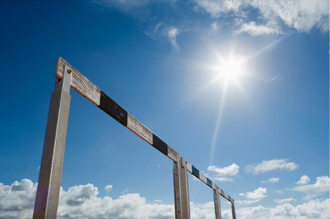 Hurdle with blue sky and sun