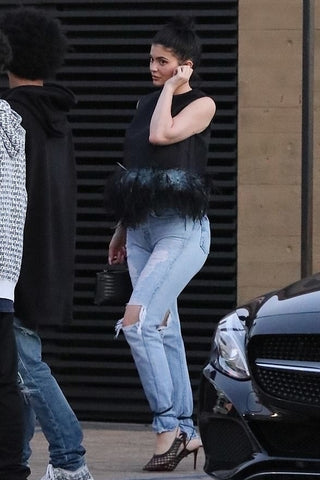 Kylie Jenner showing us that it works with jeans too, last year in Malibu.