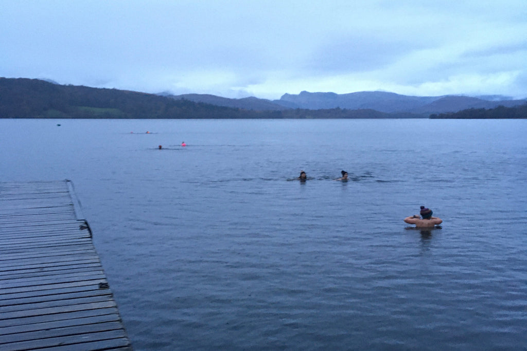 Swimmers in Windermere Lake at dawn