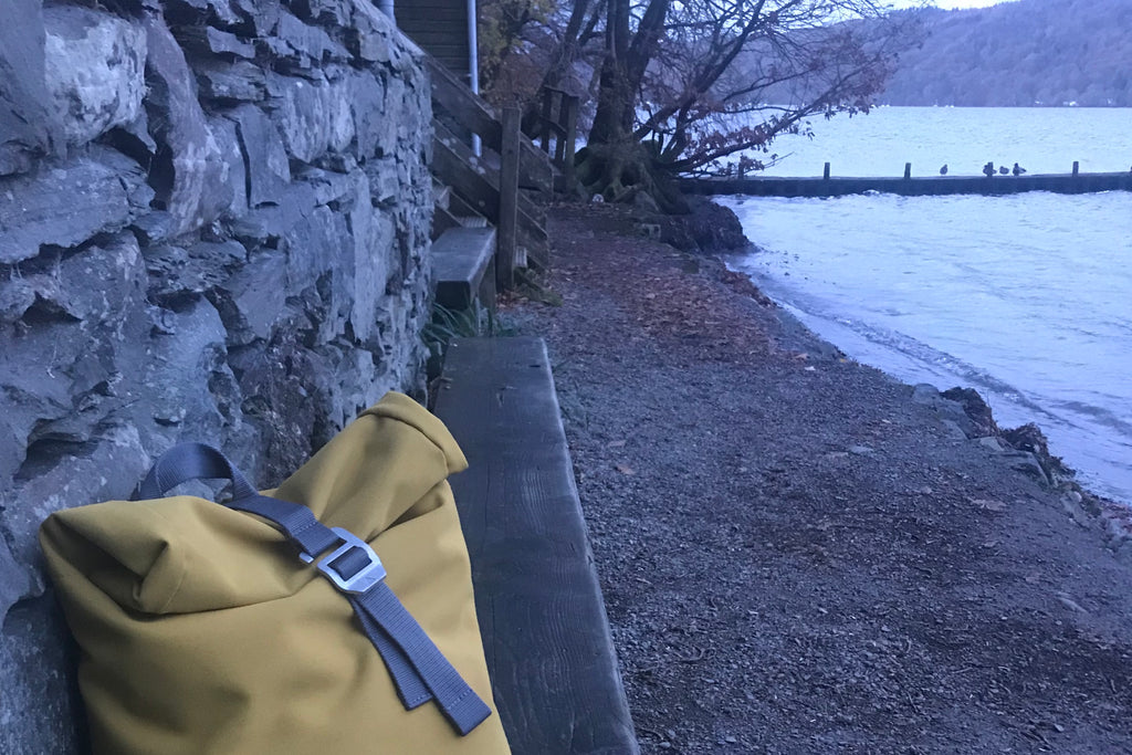 Yellow backpack by Windermere lake