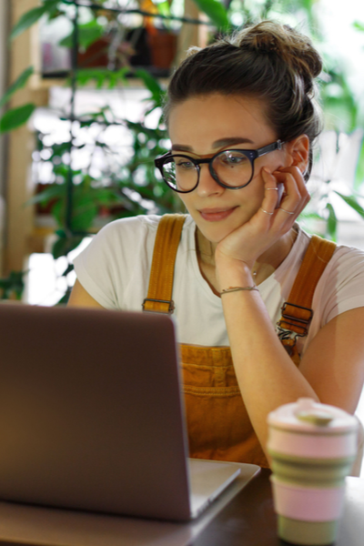 Women at Computer in a cute WFH outfit