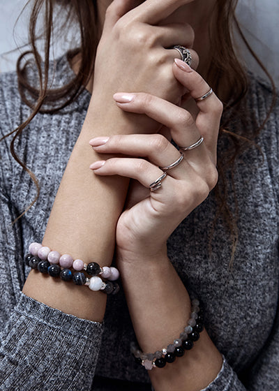 Girl wearing bracelets and rings