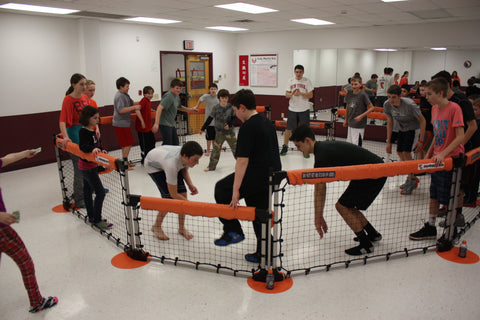 Students playing Octoball game in classroom
