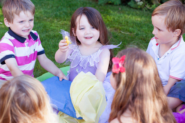 A group of children playing pass the parcel