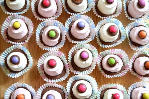 Marshmallows topped with chocolate and a Smartie