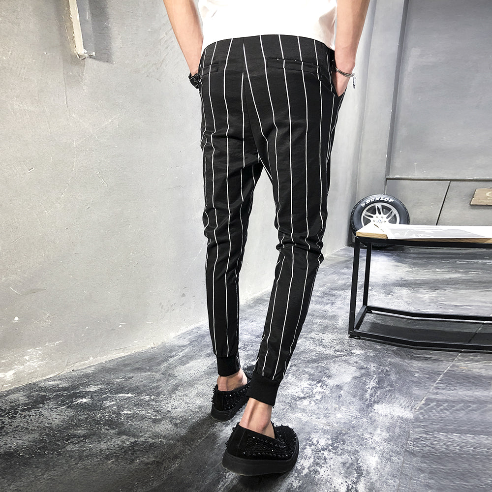 grey and black striped trousers