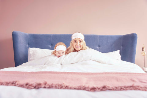 Make Mother's Day Memorable. Tiffy & Tallulah snuggling in bed with matching sleep masks. 