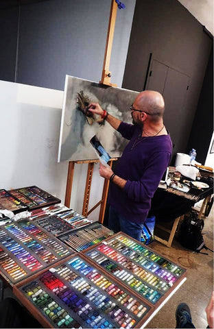 The soft pastels and pastel pencils in Vicente Romero’s studio as the master works on The Dreamer.