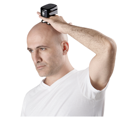 a man using skull shaver pitbull gold pro shaver on head for smooth shave