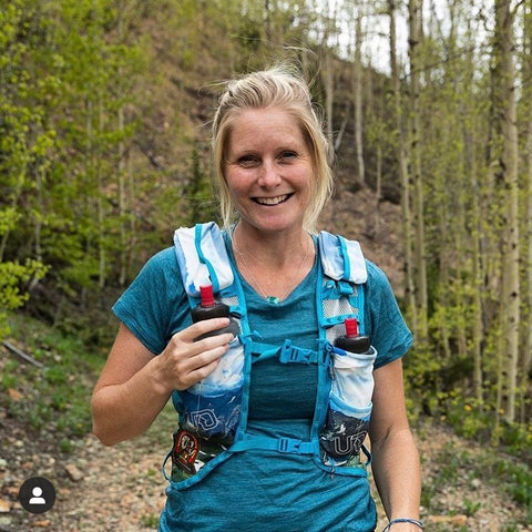 woman hiking and staying hydrated with Ultima Replenisher
