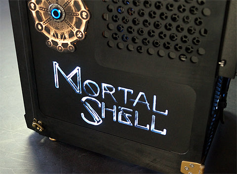 close up of cooler master HAF custom PC window with illuminated "Mortal Shell" game logo