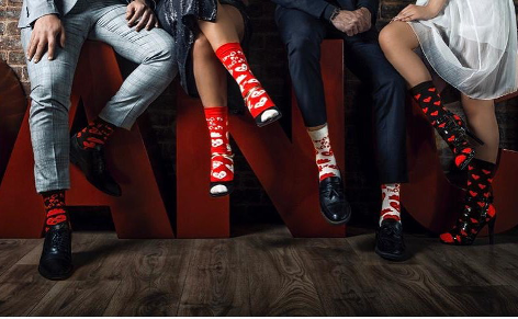Models wearing valentine's days collection love crew long socks from Tale of Socks