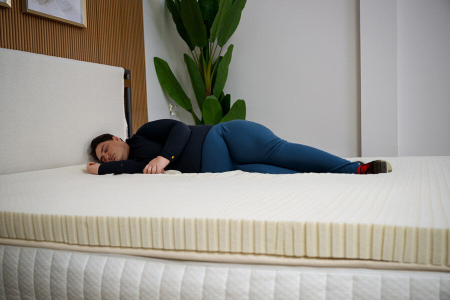 Image of a heavy weight sleeper using a 4 inch topper
