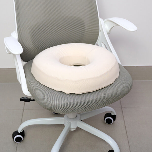 turmerry latex ring donut pillow on a chair