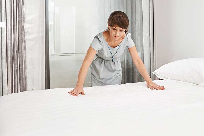 Inspecting mattress cover for wear and tear