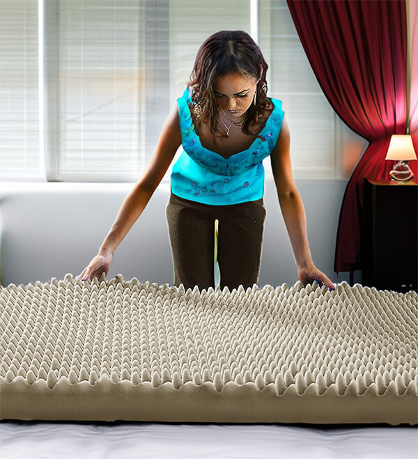 Placing the egg crate foam atop the mattress