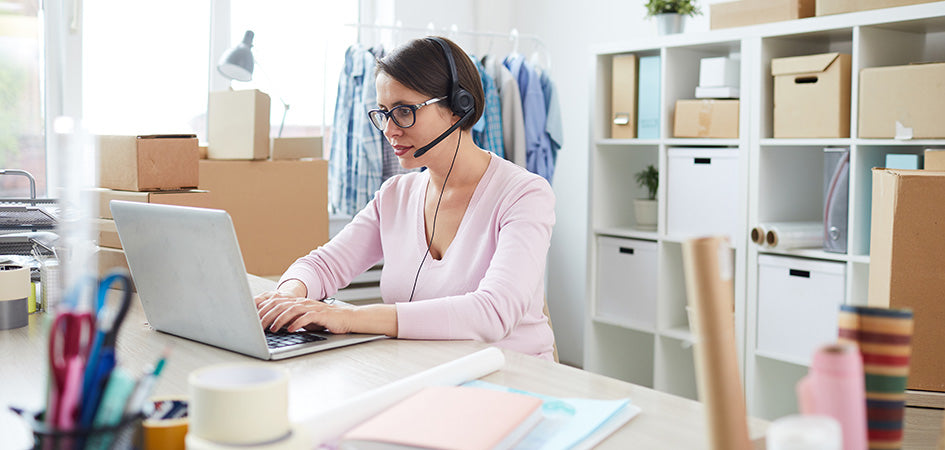 Woman working on a laptop.