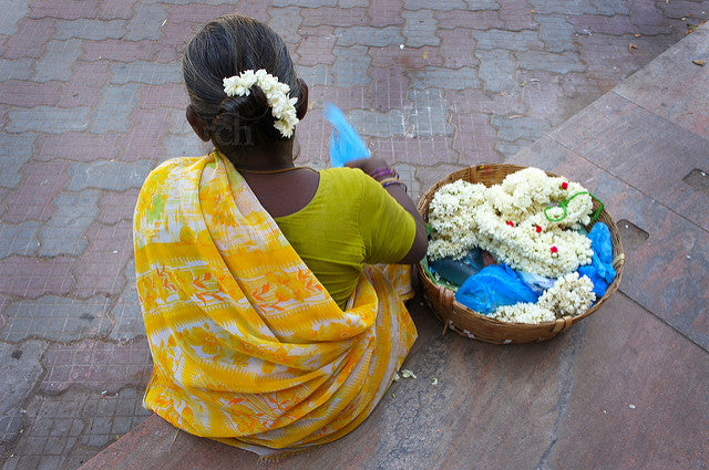 India lady selling Jasmin in Mandurai.